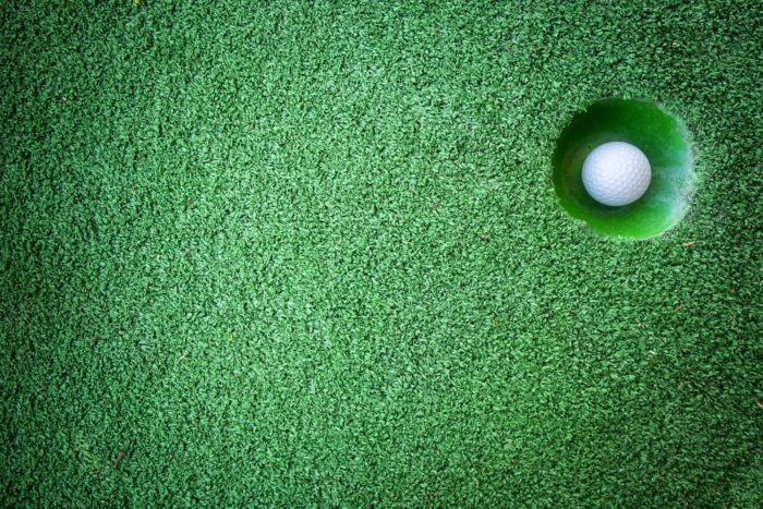 Mini golf scene with ball and hole